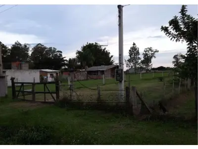 LOTE 001 - UM TERRENO LOCALIZADO NO SITIO SANTA CRUZ, MATR 76.086